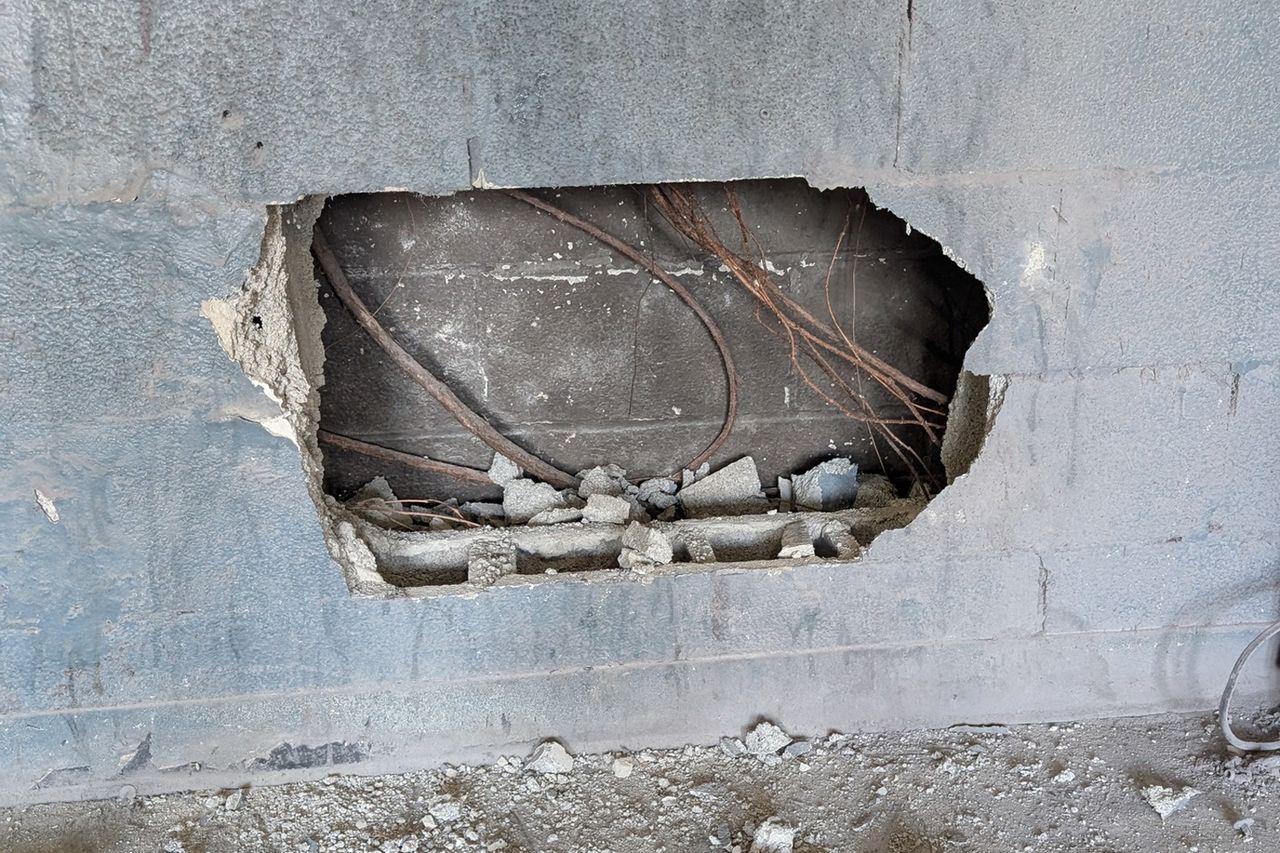Dog trapped between buildings rescued The concrete blocks the firefighters removed from the wall to free the dogCredit: Nashville Fire Department