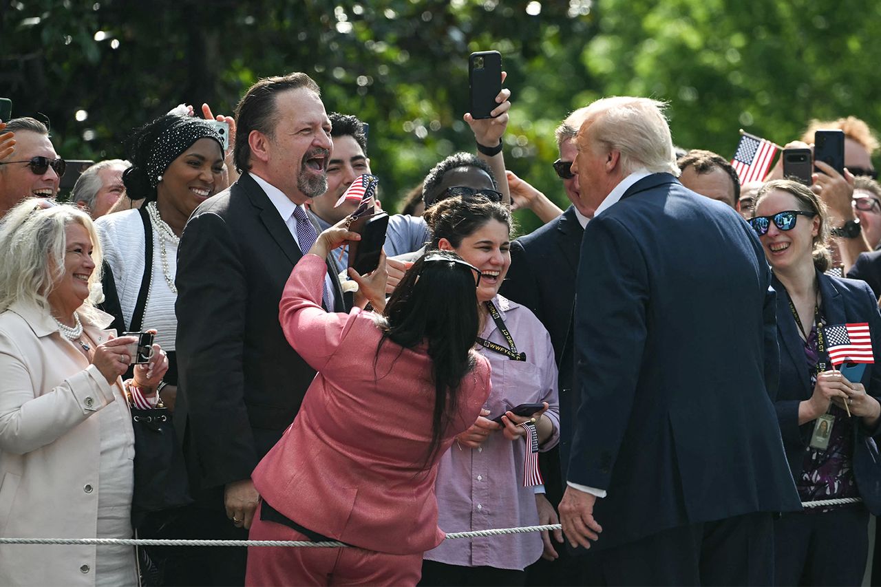 US President Donald Trump stops to talk with Sebastian Gorka at the White House on July 11, 2025.Credit: ANDREW CABALLERO-REYNOLDS/AFP via Getty