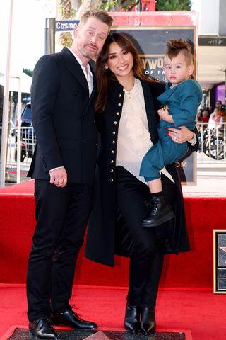 Macaulay Culkin, Brenda Song and their eldest son, Dakota, in December 2023.Credit: Anna Webber/Variety via Getty