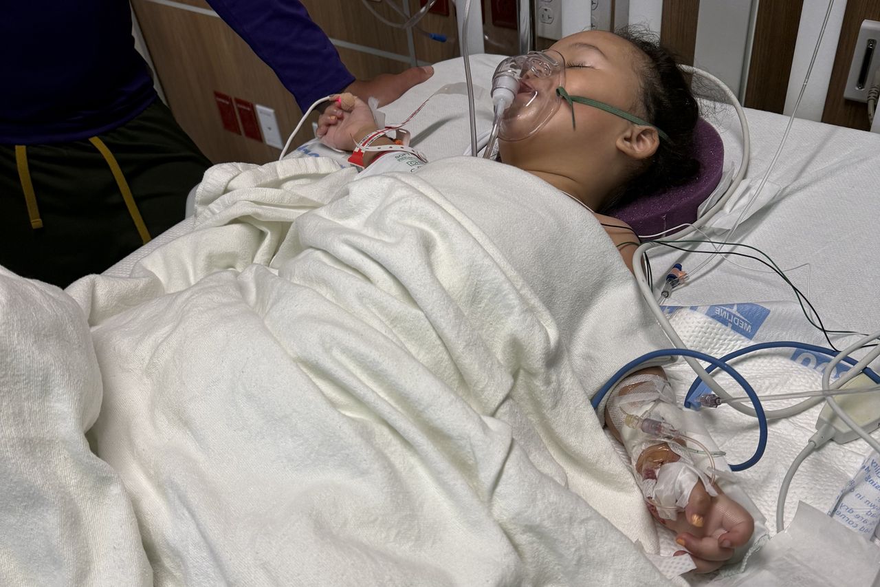 Two-year-old Milah ran around playing and jumping in-and-out of an inflatable pool at her dad's birthday party. When she woke from a nap, she couldn't stand, and when her parents had her walk, she limped. Her parents took her to the emergency room thinking maybe she had a sprained ankle. The next day, she couldn't even sit up, and soon she was paralyzed waist down. She was diagnosed with a spinal AVM. She had an 8-hour surgery, then months of rehab learning to walk again. Milah Faciane at Dell Children's Hospital in May 2025Credit: Courtesy of Linda Huynh and Blake Faciane