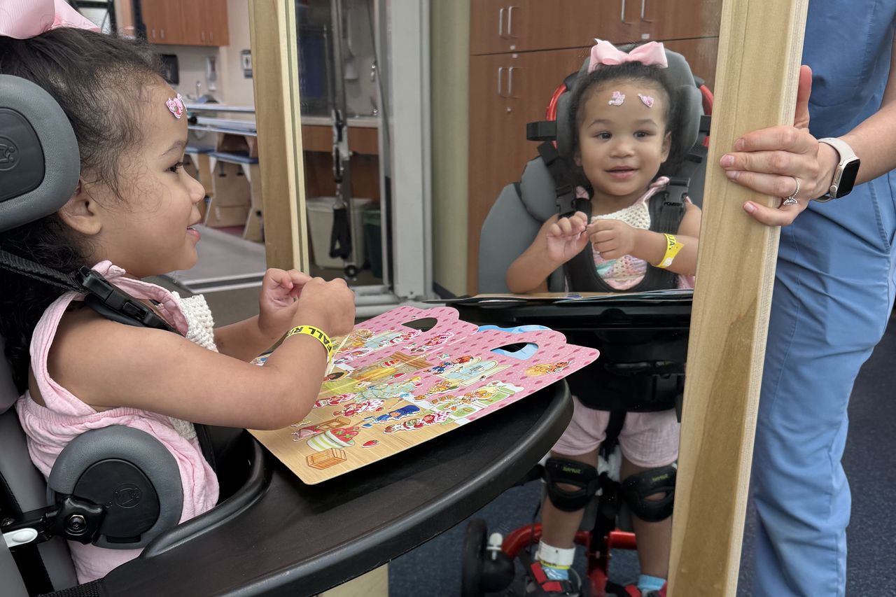 Two-year-old Milah ran around playing and jumping in-and-out of an inflatable pool at her dad's birthday party. When she woke from a nap, she couldn't stand, and when her parents had her walk, she limped. Her parents took her to the emergency room thinking maybe she had a sprained ankle. The next day, she couldn't even sit up, and soon she was paralyzed waist down. She was diagnosed with a spinal AVM. She had an 8-hour surgery, then months of rehab learning to walk again. Milah at Dell Children's in May 2025Credit: Courtesy of Linda Huynh and Blake Faciane