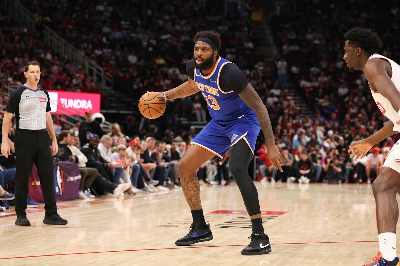Mitchell Robinson 23 of the New York Knicks dribbles during the first quarter against the Houston Rockets at Toyota Center on March 31, 2026 in Houston, Texas. Mitchell Robinson of the New York Knicks on March 31, 2026, in Houston.Credit: Jack Gorman/Getty