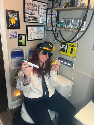 Molly Bina's inside her airplane-themed bathroomCredit: Courtesy of Molly Bina