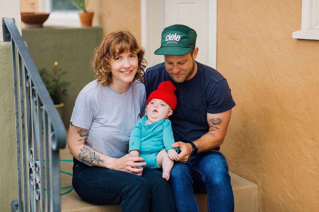 From left, Aimee and Bryan Wingen with Waylynn on steps of their California home where they sold bread during COVID-19Credit: Francesca Penko Photography