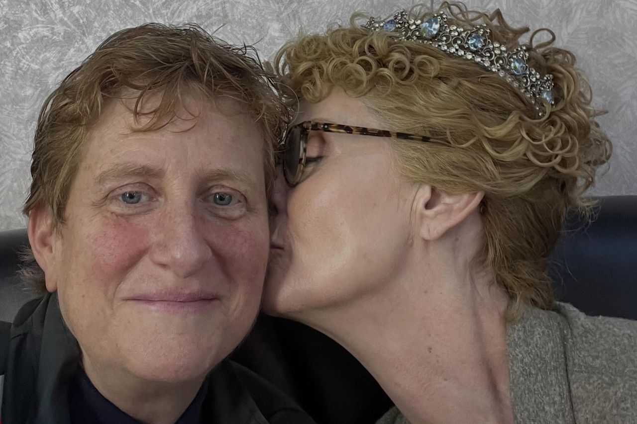Cynthia Nixon kissing Christine Marinoni's cheekCredit: cynthiaenixon/Instagram