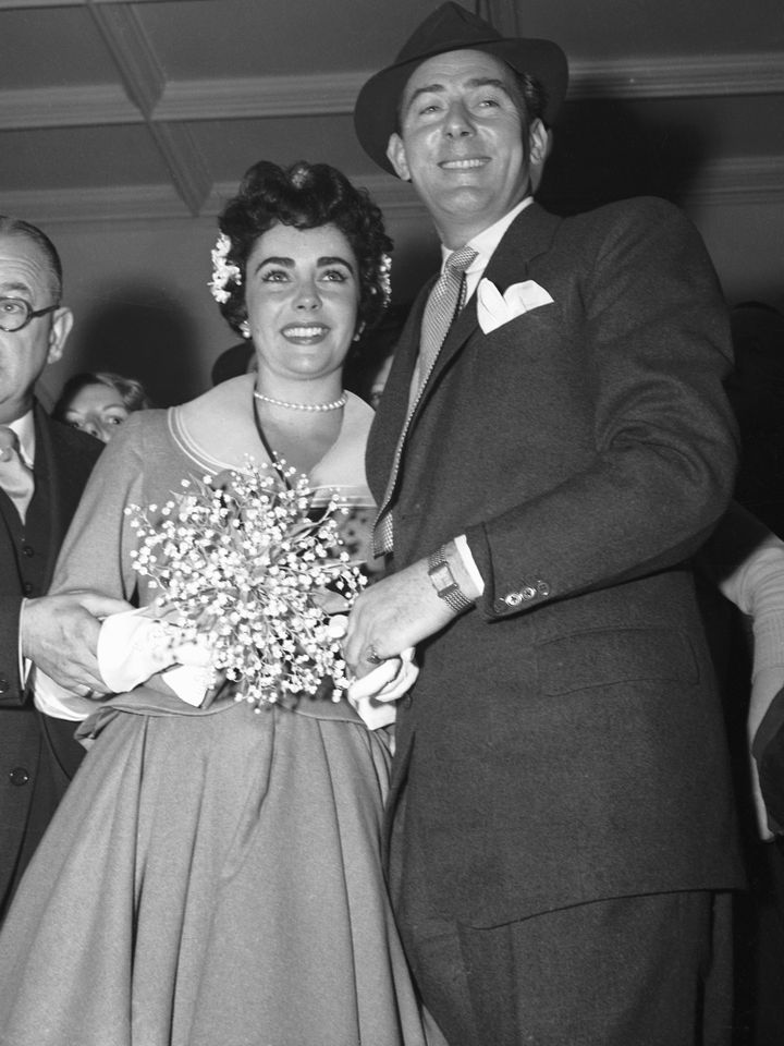 Elizabeth Taylor and Michael Wilding pose for cameras following their marriage on February 21, 1952.Credit: Bettmann