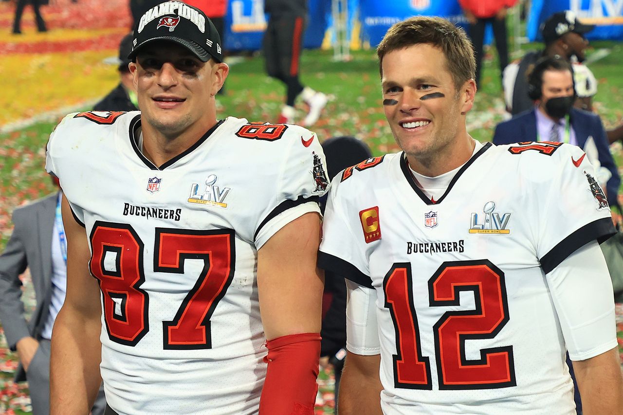Rob Gronkowski #87 and Tom Brady #12 of the Tampa Bay Buccaneers celebrate after defeating the Kansas City Chiefs in the Super Bowl in 2021.Credit: Mike Ehrmann/Getty