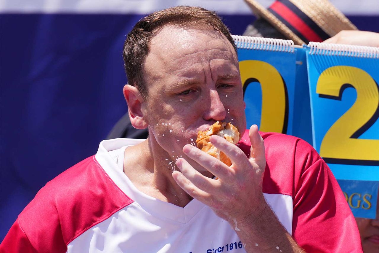 Joey Chestnut competes in at Nathan's Annual Hot Dog Eating Contest on July 4, 2025.Credit: Adam Gray/Getty