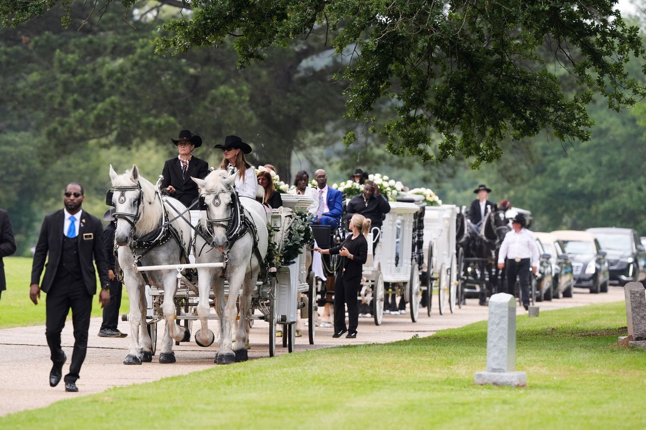 Caissons carry the caskets of the eight children who were killed during a mass shooting on April 19Credit: AP Photo/Gerald Herbert