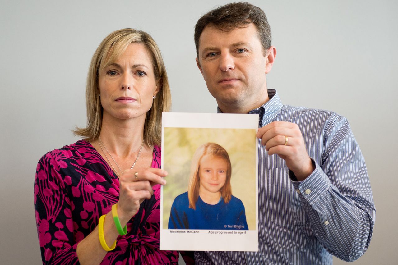 Kate and Gerry McCann pose with an artist's impression of how their daughter might look now at the age of nine on May 2, 2012.Credit: LEON NEAL/AFP/Getty