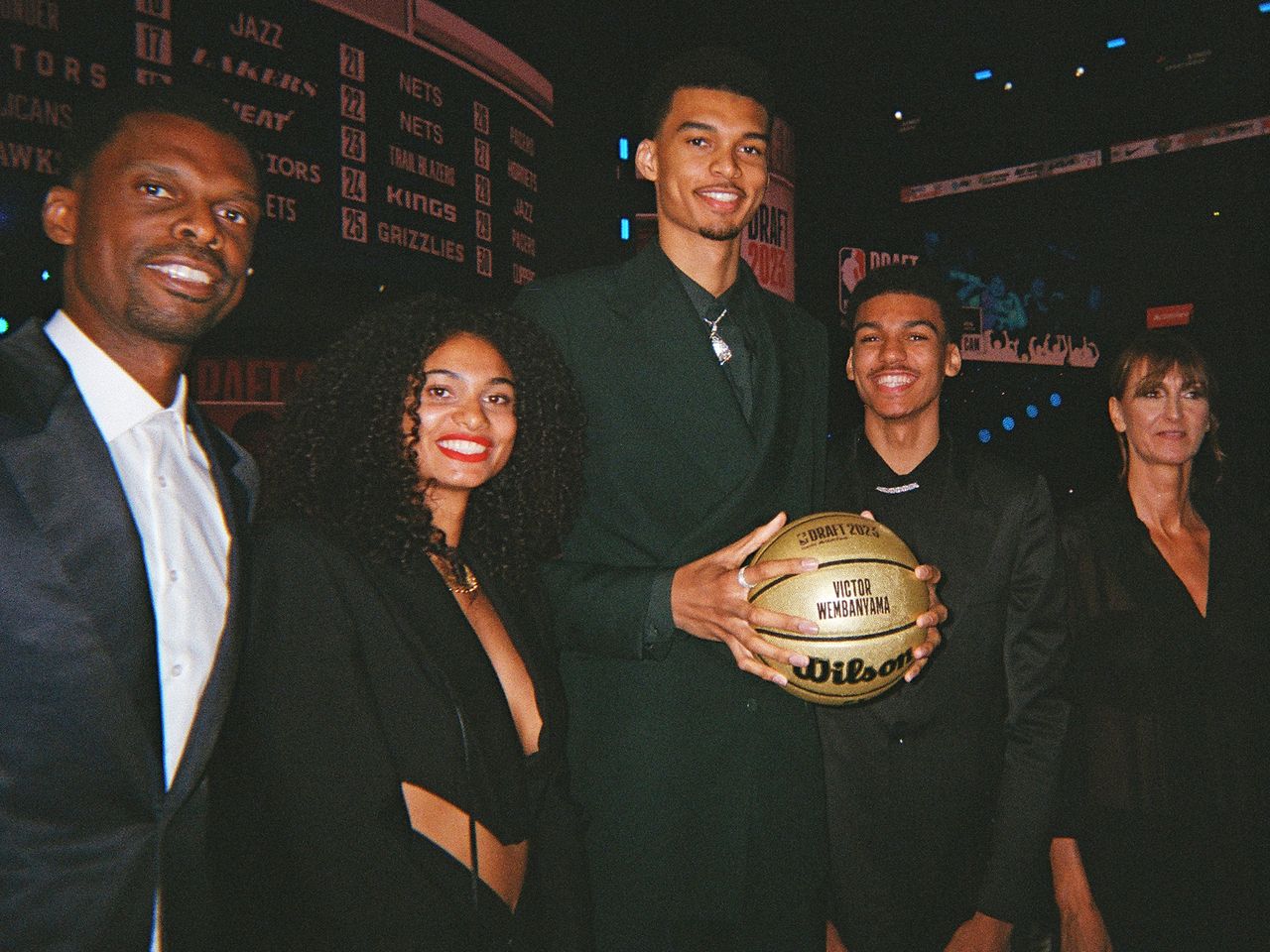 Victor Wembanyama poses for a photograph with family during the 2023 NBA Draft on June 22, 2023 at Barclays Center in Brooklyn, New York.Credit: Jenny Fischer/NBAE/Getty