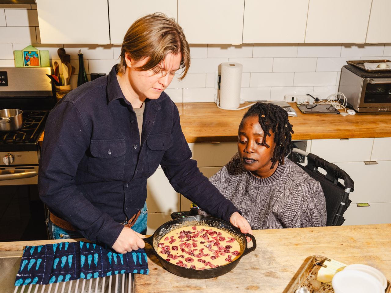 Yewande Komolafe Recipe Developer Learning How to Cook After After Losing Her Fingers and Legs Stan De Tilly (L), one of Komolafe's (R) cooking assistants, works alongside her in the kitchenCredit: Lanna Apisukh