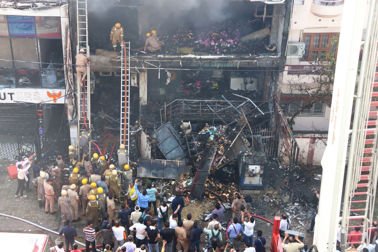 Firefighters and SDRF teams searching the gutted building after a massive fire broke out inside 15 people were killed in a devastating fire in Lucknow, India, on June 22.Credit: Deepak Gupta/Hindustan Times via Getty