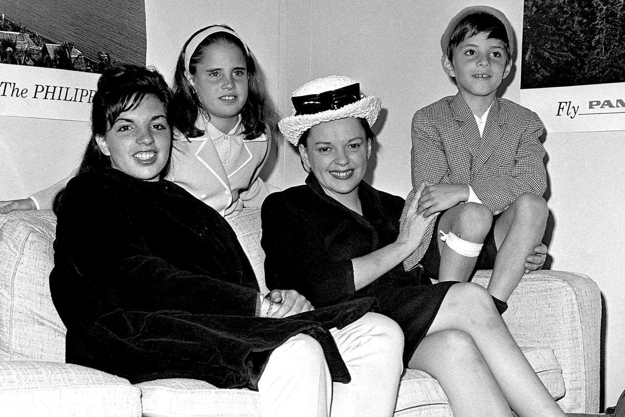 Judy Garland and her children Liza Minnelli, Lorna Luft and Joey Luft waiting for their flight to London in the Idlewild lounge at the airport.Credit: Getty