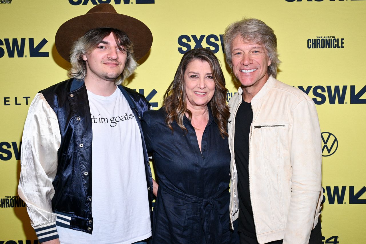 Three individuals at an event in front of a yellow background with SXSW branding Jon Bon Jovi with wife Dorothea and son Roemeo in 2024Credit: Michael Buckner/Getty
