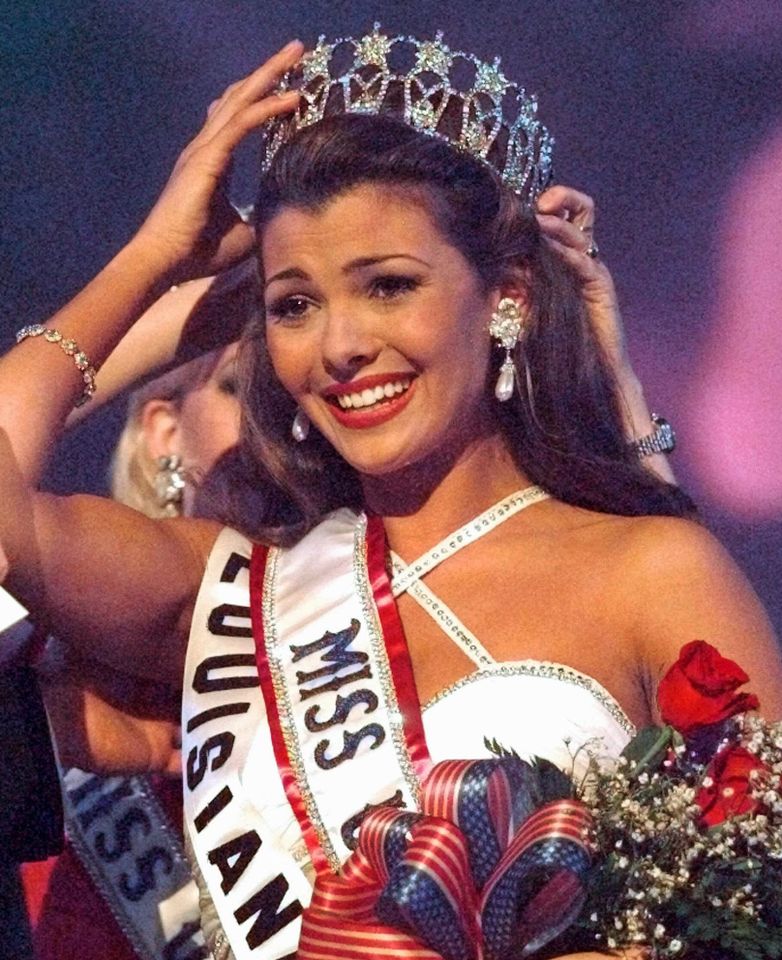 Ali Landry of Louisiana adjusts her new crown with the help of Shanna Lynn Moakler after winning Miss USA 1996 in South Padre Island, Texas, on Feb. 2, 1996Credit: Pat Sullivan/AP