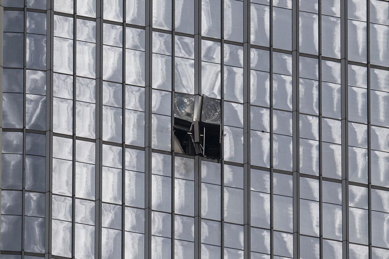 Two glass panel on CITIC Tower appear damaged following reports of a plane crash in Beijing on June 26Credit: Kevin Frayer/Getty