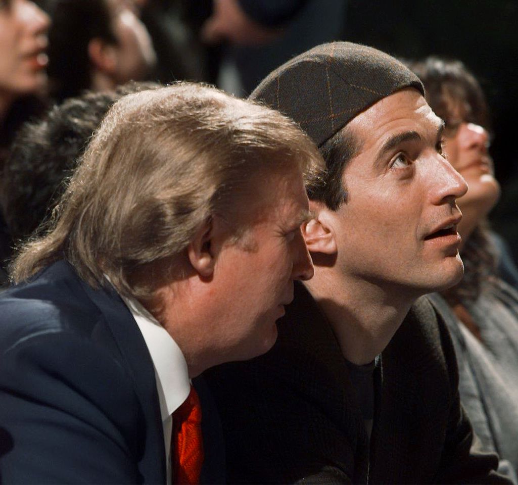 Donald Trump (left) and John F. Kennedy Jr. watch a New York Knicks game on March 31, 1999, at Madison Square Garden.Credit: Keith Torrie/NY Daily News Archive via Getty