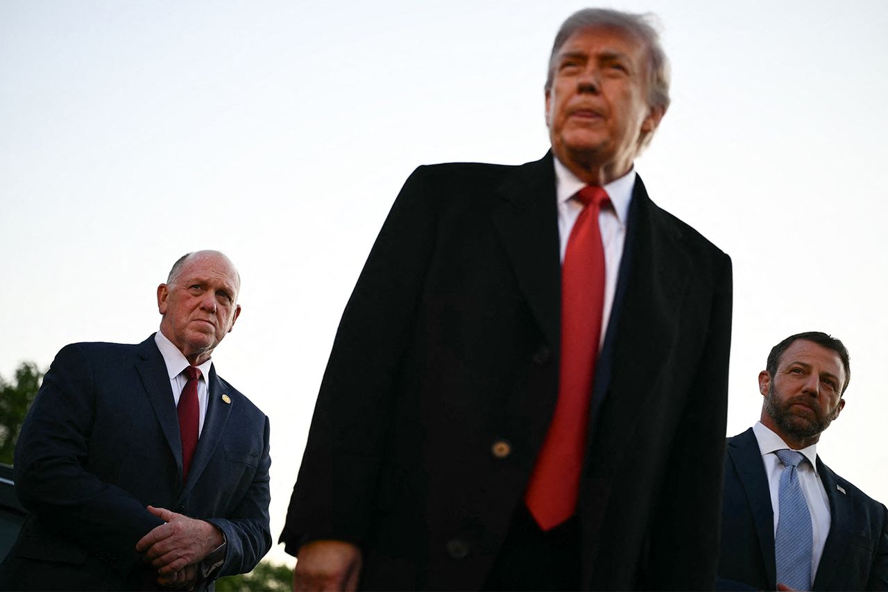 President Donald Trump, flanked by White House 'border czar' Tom Homan (left) and Homeland Security Secretary Markwayne Mullin, right, athe Lincoln Memorial Reflecting Pool in Washington on May 7.Credit: Kent NISHIMURA / AFP via Getty