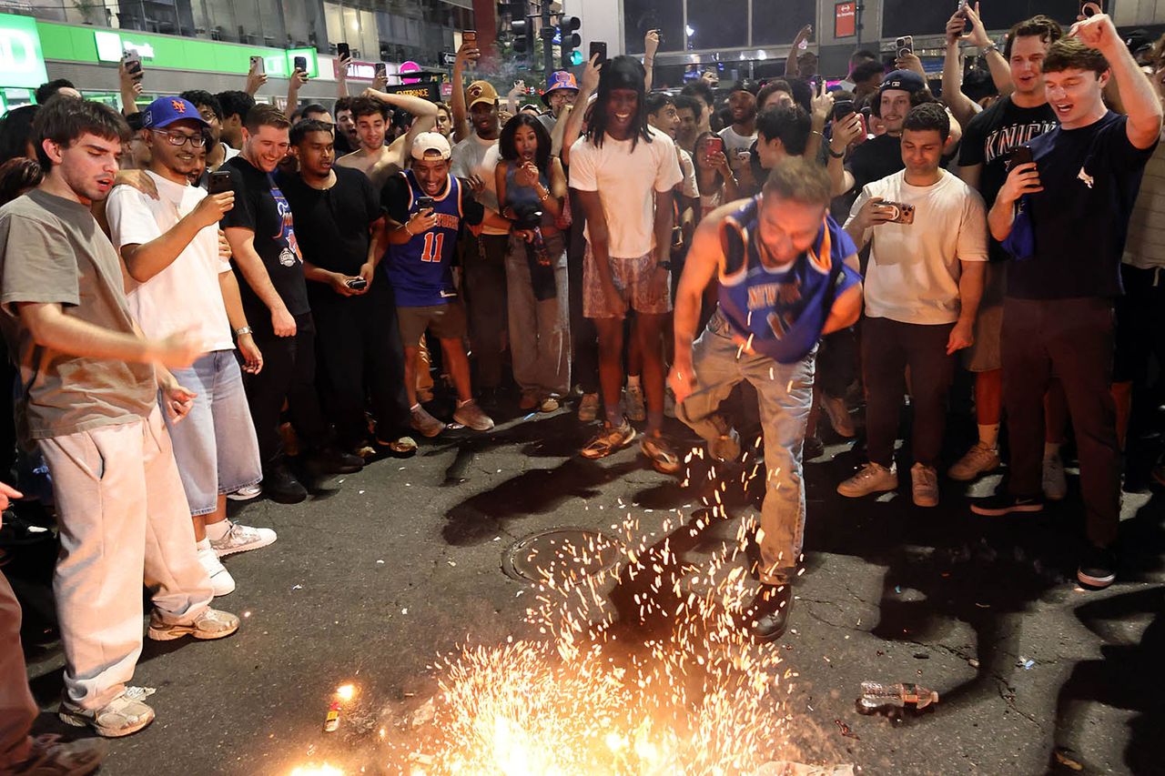 Crowds in N.Y.C. light fireworks after the Knicks' NBA title winCredit: Michael Heiman/Getty