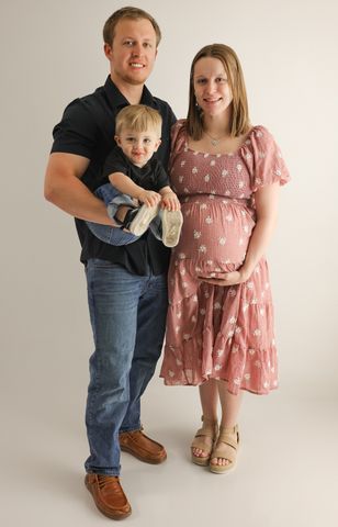 Patrick Fischer and Marae Hanson pregnant with their quads and their son Atticus.Credit: Kourtney Bowman/Rumored Photography