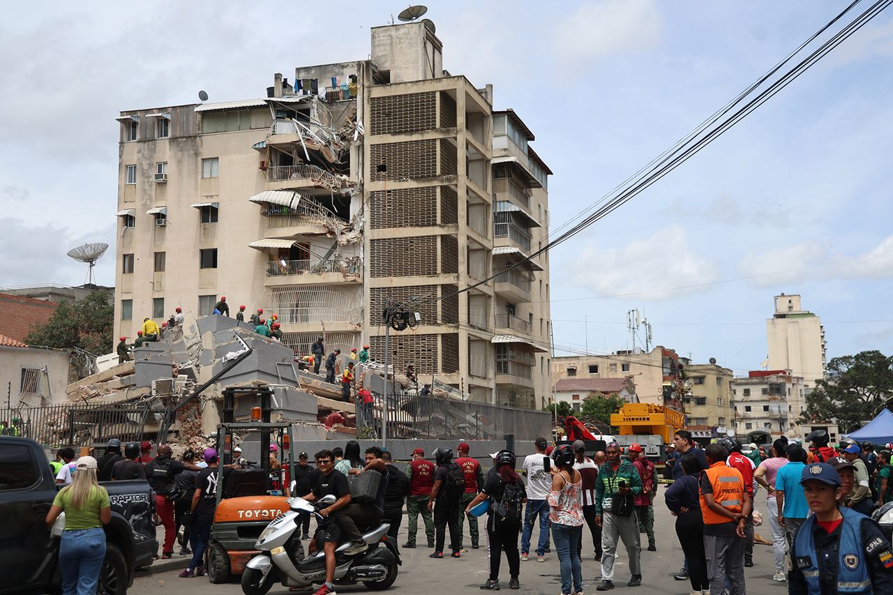 Rescuers work on the debris of a collapsed building after the earthquakes in Caracas, Venezuela, on June 25Credit: Edilzon Gamez/Getty
