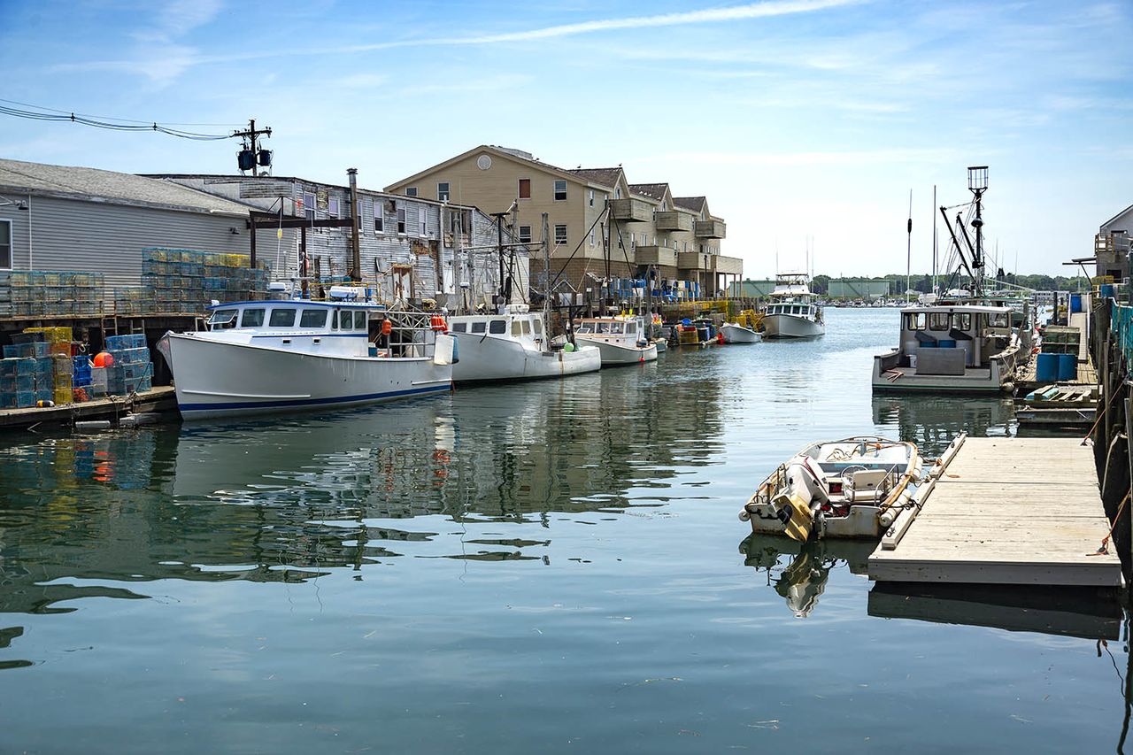 A pier filled with lobster traps and an old building, old port, in Portland, Maine. A fishing pier in Portland, MaineCredit: Getty