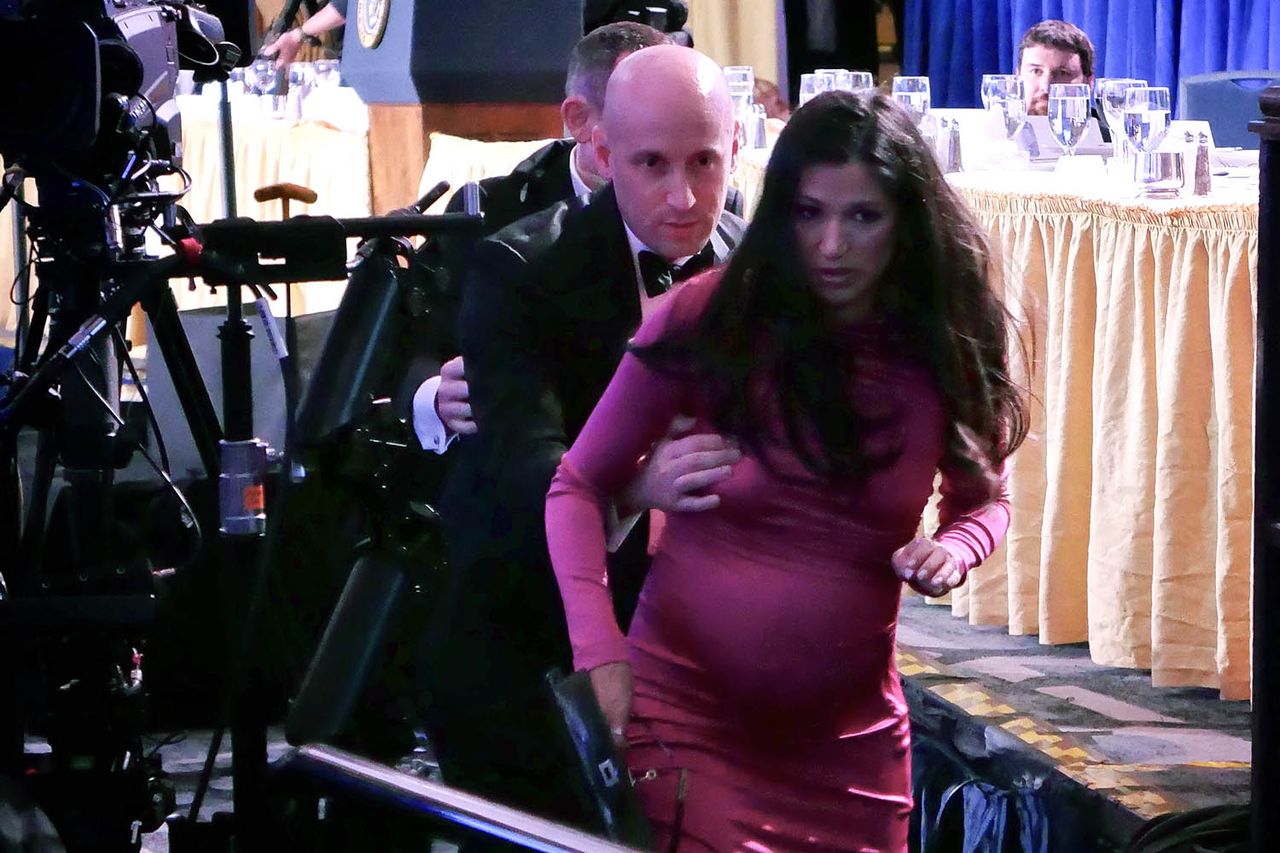 Stephen and Katie Miller are evacuated from the White House Correspondents' Dinner on April 25.Credit: Chip Somodevilla/Getty