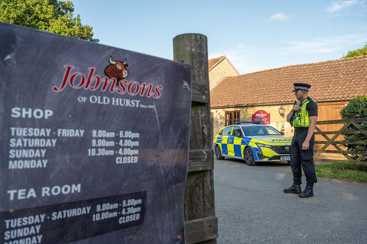 Police at Johnsons of Old Hurst in England on Thursday, June 18Credit: SWNS