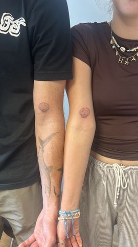 Two peoples arms displaying matching tattoos on their inner elbows with one arm belonging to a male and the other to a female Jack Ellison and Heidi Montague show off their matching tattoosCredit: Kennedy News & Media