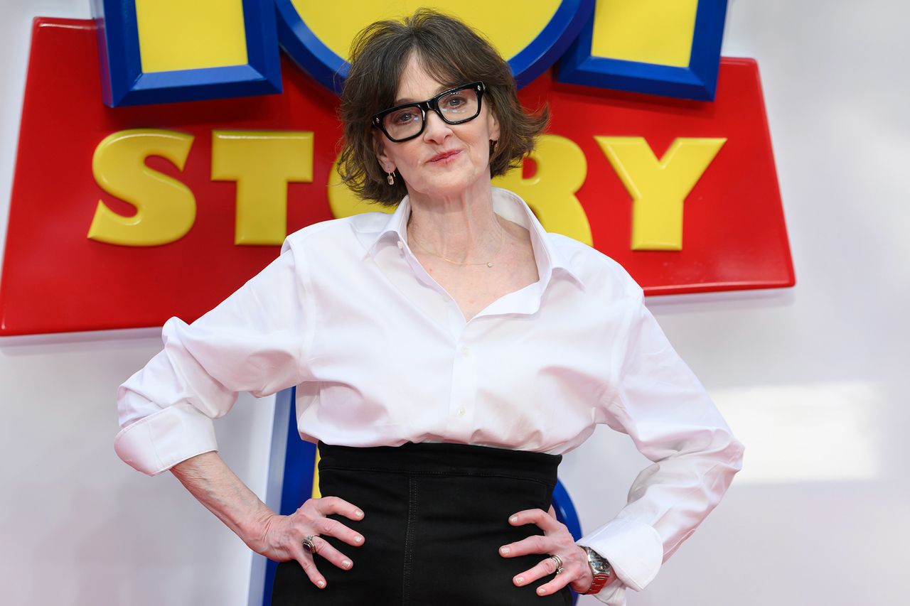 Joan Cusack posing with hands on hips in front of a Toy Story sign Joan CusackCredit: Karwai Tang/WireImage