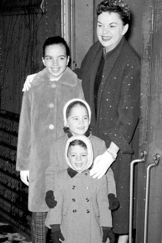 Judy Garland poses with her three children Liza, Lorna and Joey on arrival at Grand Central Station.Credit: Getty