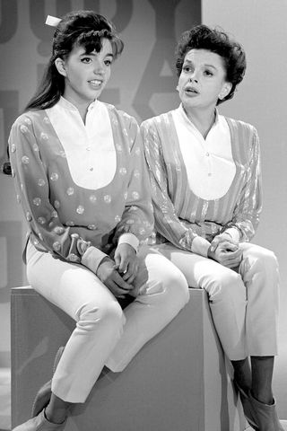 Liza Minnelli is shown with her mother, Judy Garland, as the two rehearse for her mother's new television show.Credit: Bettmann Archive/Getty