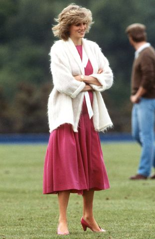 Diana, Princess of Wales, wearing a pink sailor style dress with a white collar and white mohair cardigan while pregnant with Prince Harry, attends a polo match at Guards Polo Club on June 7, 1984 in Windsor, United Kingdom. Princess Diana attends a polo match at Guards Polo ClubCredit: Anwar Hussein/Getty
