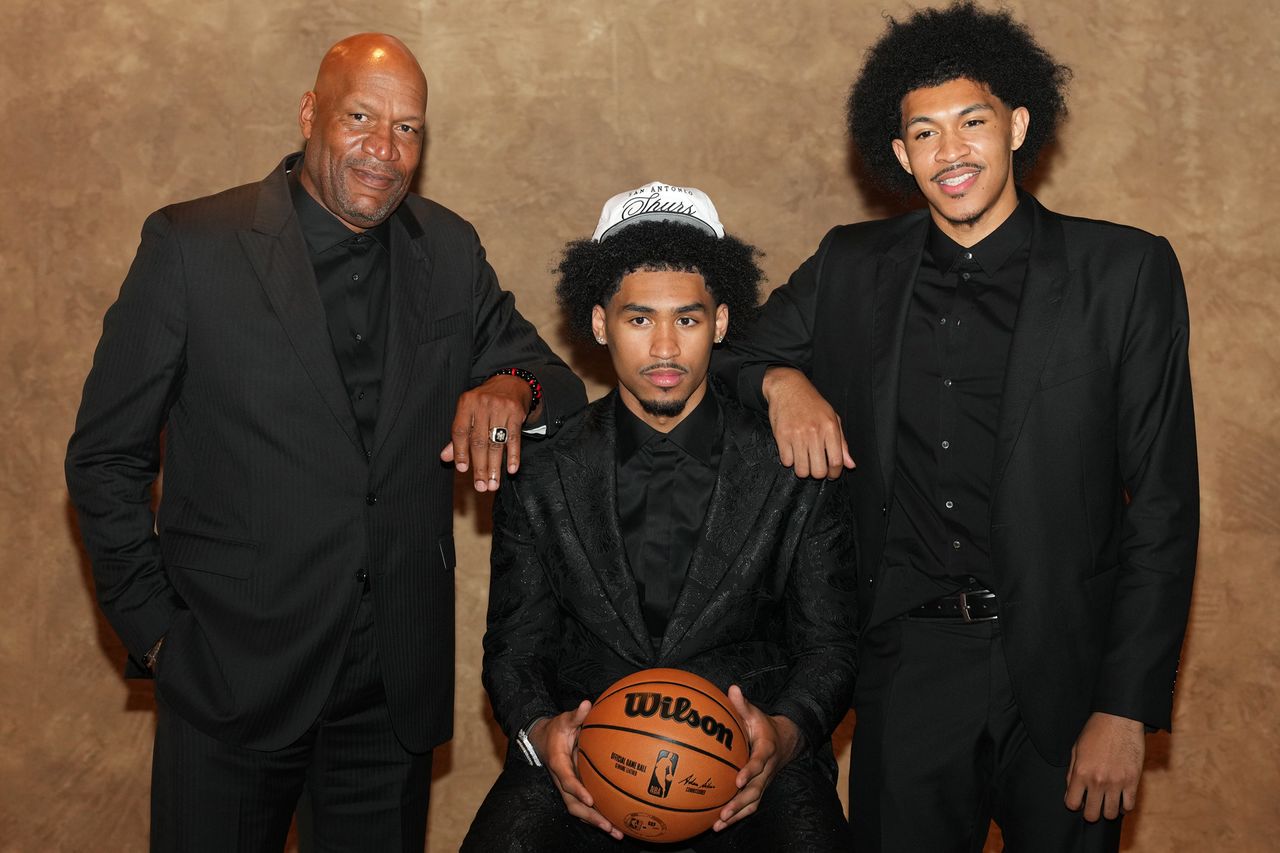 Dylan Harper, Ron Harper and Ron Harper Jr. after Dylan was drafted by the San Antonio Spurs during the 2025 NBA Draft - Round One on June 25, 2025 at Barclays Center in Brooklyn, New York.Credit: Evan Yu/NBAE via Getty