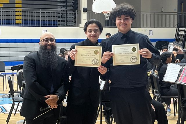 Elmer Feliciano (left) with two of his studentsCredit: Courtesy Elmer Feliciano