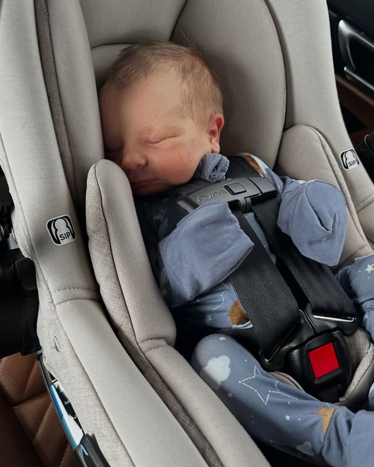 A sleeping baby in a car seat Kelcey Wetterberg and Nate Crnkovich holding their newborn baby JackCredit: Kelcey Wetterberg/instagram