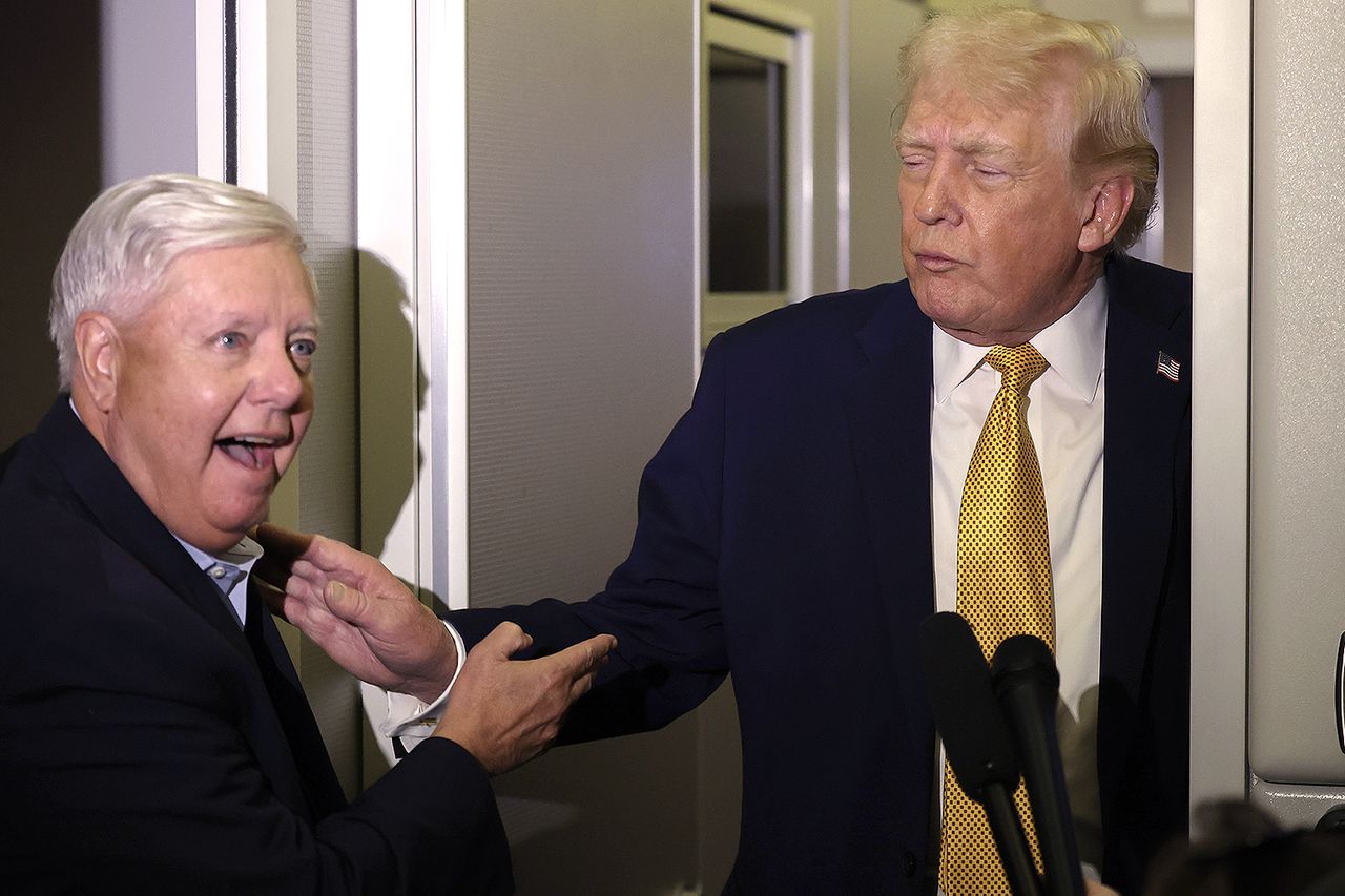 Sen. Lindsey Graham, R-S.C., and President Donald Trump on Air Force One on Jan. 4.Credit: Joe Raedle/Getty