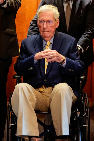 Sen. Mitch McConnell, R-Ky., is pushed in a wheelchair during a vote at the U.S. Capitol Building on April 13, 2026, in Washington.Credit: Heather Diehl/Getty