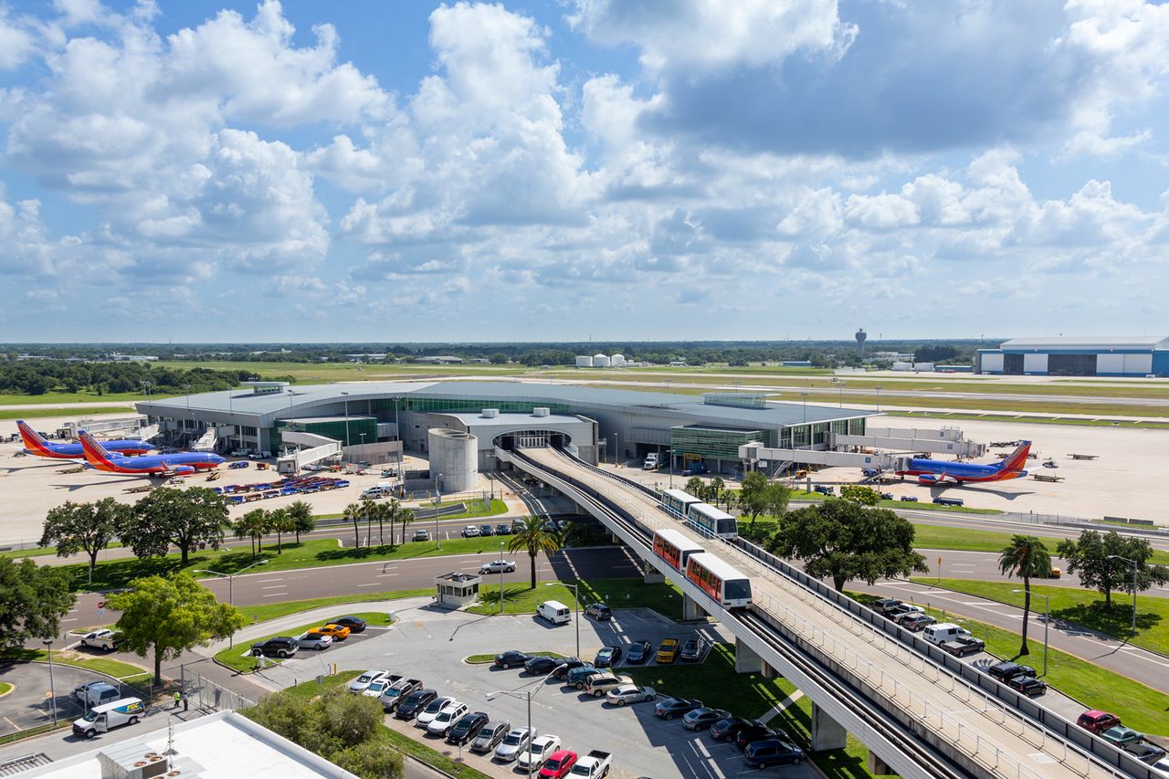 Overhead view of Tampa International Airport with trains running on track to the terminal Tampa International AirportCredit: Getty
