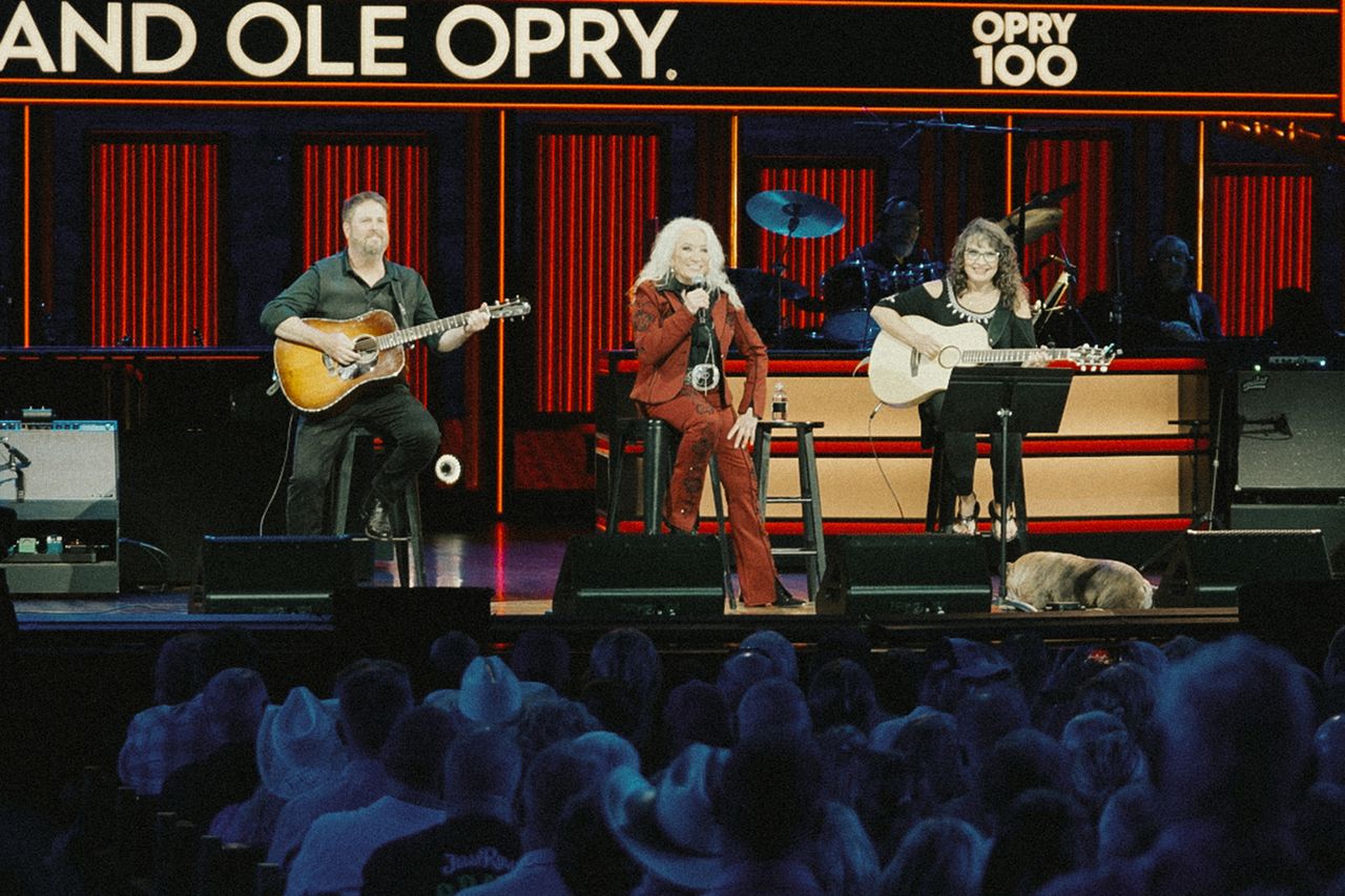 A performance on stage at the Grand Ole Opry featuring three musicians two playing guitars and one singing Tanya Tucker at the Grand Ole Opry in June 2026Credit: Caleb Herring