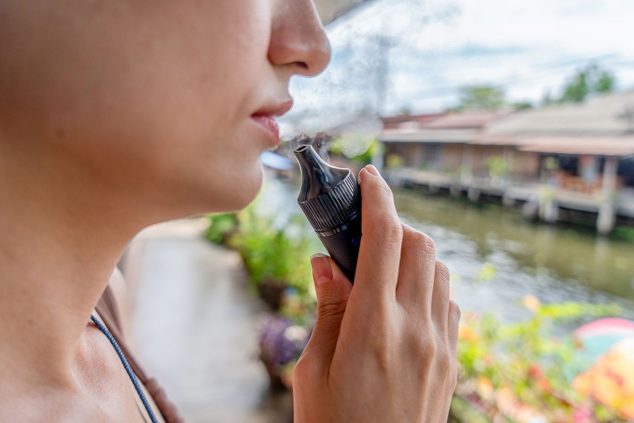 Stock photo of a person smoking an e-cigaretteCredit: Boonchai Wedmakawand/Getty