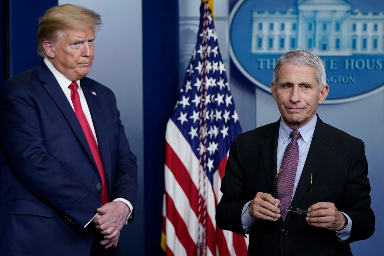 Dr. Anthony Fauci, director of the National Institute of Allergy and Infectious Diseases, and President Donald Trump participate in a briefing at the White House on April 22, 2020.Credit: Drew Angerer/Getty