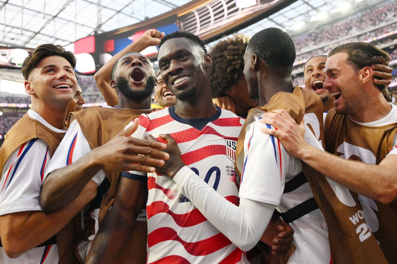 Folarin Balogun celebrates with teammates during the 2026 World Cup football match between USA and Paraguay on June 12, 2026, in Inglewood, Calif.Credit: Patrick T. Fallon / AFP via Getty