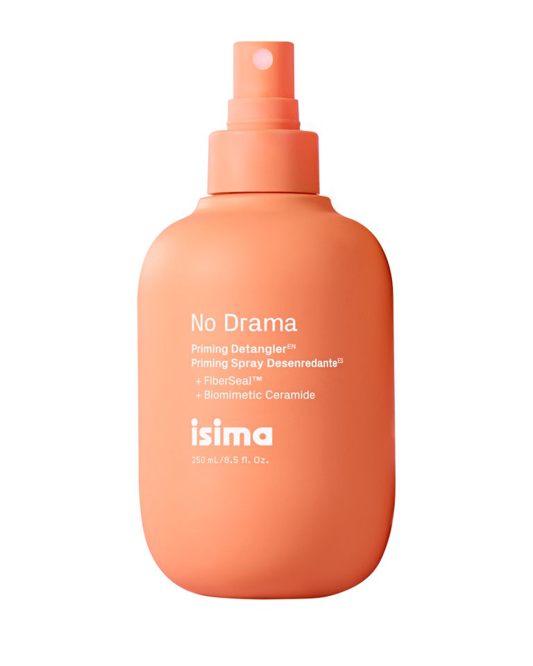 Haircare spray product in orange bottle labeled No Drama by isima
