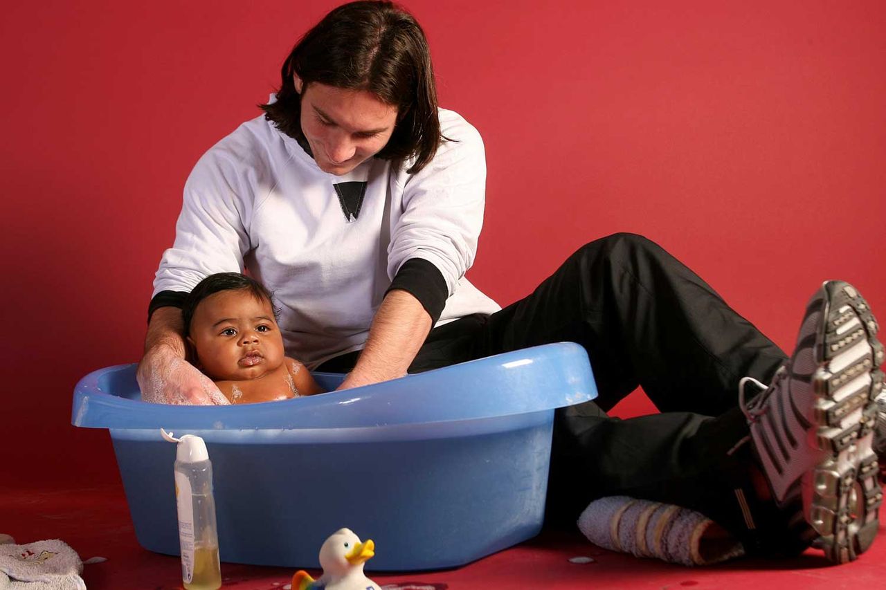 20-year-old soccer star Lionel Messi helps to bathe Lamine Yamal, who was merely six months old at the time, during a photo session in Sept. 2007 in the dressing room of the Camp Nou stadium in Barcelona, Spain. 20-year-old soccer star Lionel Messi helps to bathe Lamine Yamal, who was merely six months old at the time, during a photo session in Sept. 2007 in the dressing room of the Camp Nou stadium in Barcelona, Spain.Credit: Joan Monfort/AP