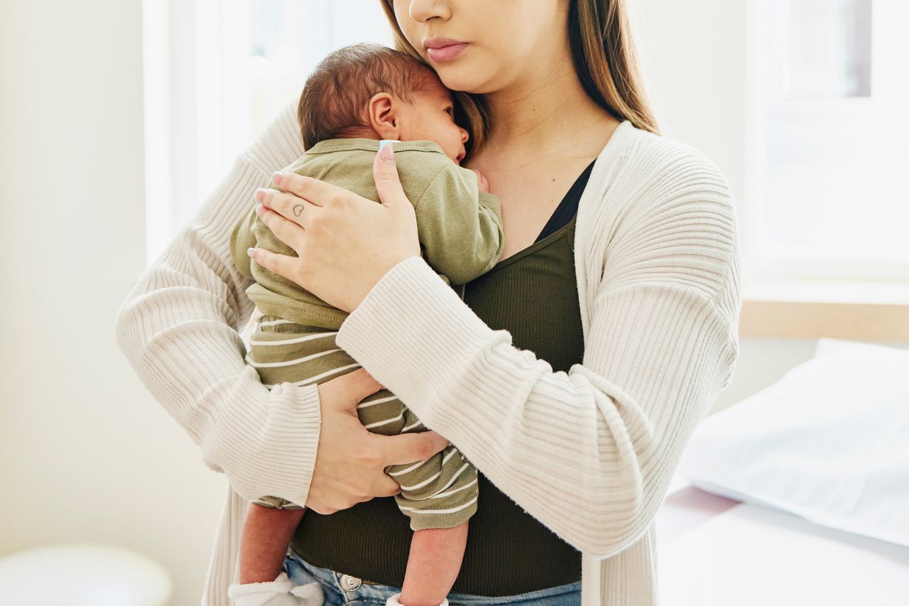 Stock image of a mother holding a newbornCredit: Getty
