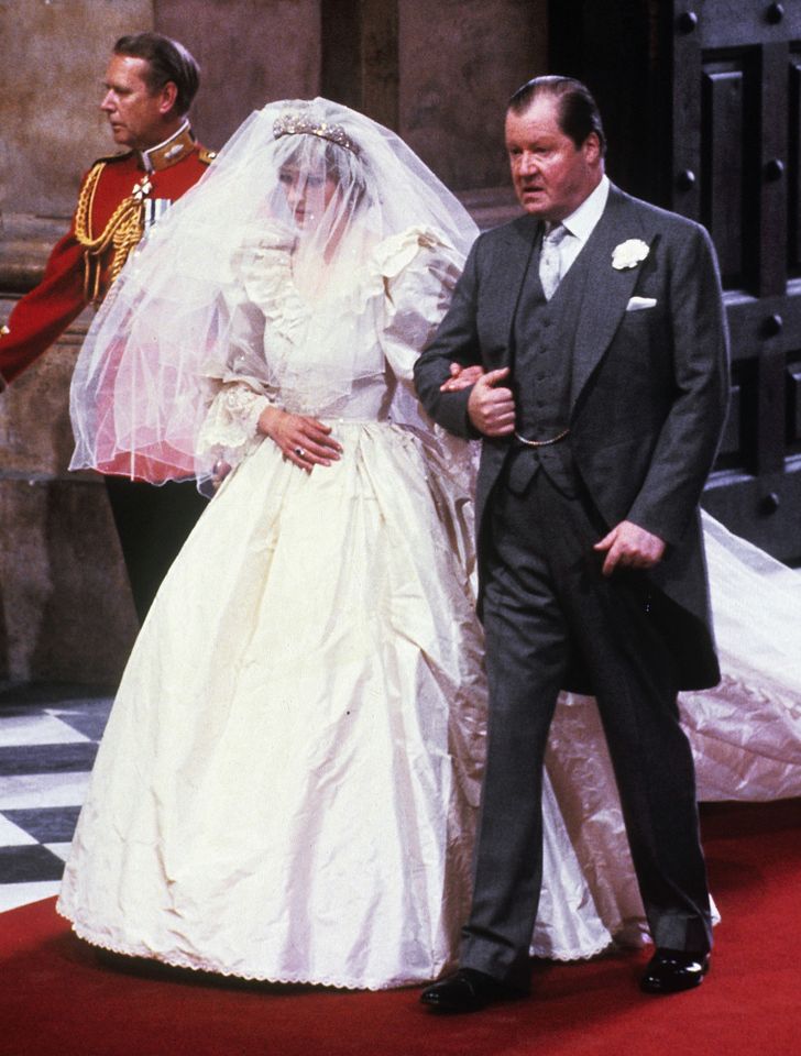 Princess Diana walking down the aisle with her father, Earl Edward John Spencer.Credit: Anwar Hussein/Getty