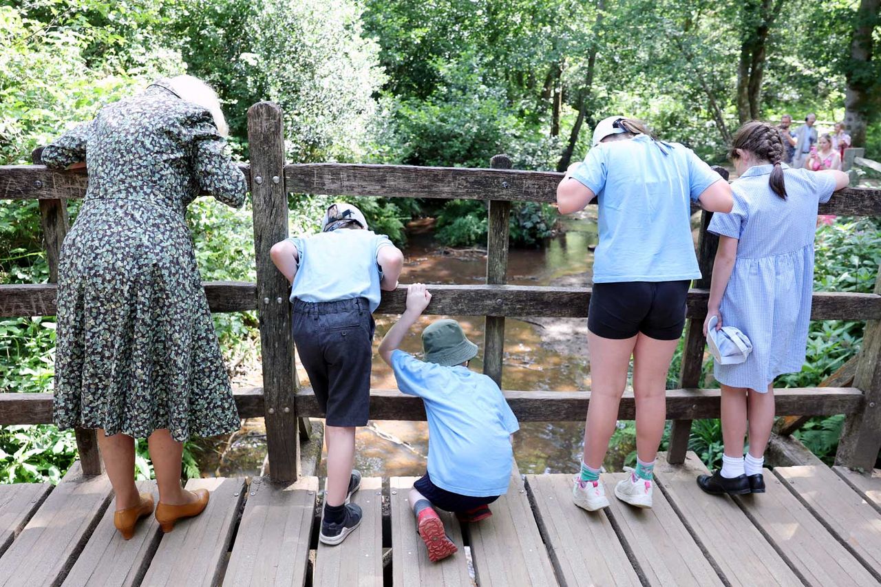 Queen Camilla plays Poohsticks at Ashdown Forest on July 7, 2026Credit: Chris Jackson/Getty
