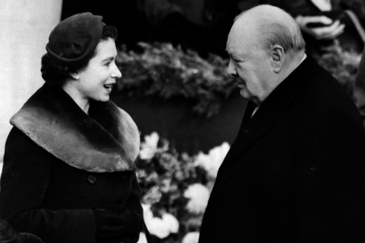 1953: Elizabeth II, Queen of England with Prince Charles and Princess Anne chatting to Sir Winston Churchill (1874 - 1965) Queen Elizabeth and Winston Churchill in 1953Credit: Central Press/Getty